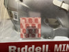 Close-up of Beckett authentication sticker and Ohio State licensing label on Chris Olave Riddell mini helmet packaging